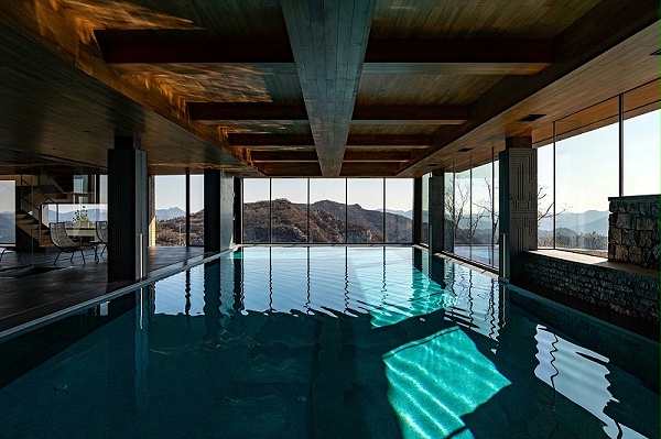 亿伽设计-汤泉设计-崖壁泳池度假酒店：原始洞穴体验的空间转译